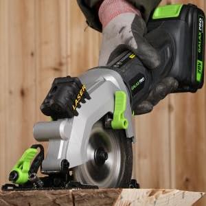 a person using a circular saw to cut wood