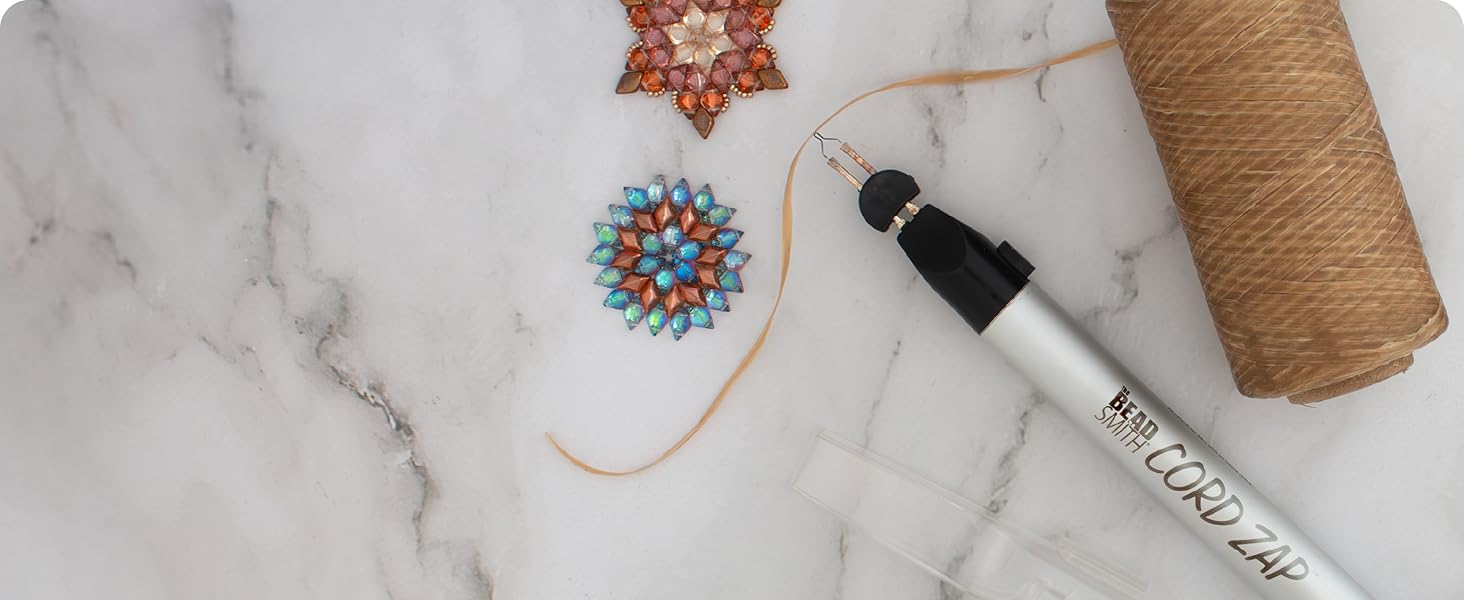 Thread zap cord on marble table with brown jewelry and artificial sinew cord