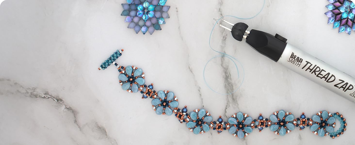 Thread zap on marble background with a blue bracelet and blue miyuki thread