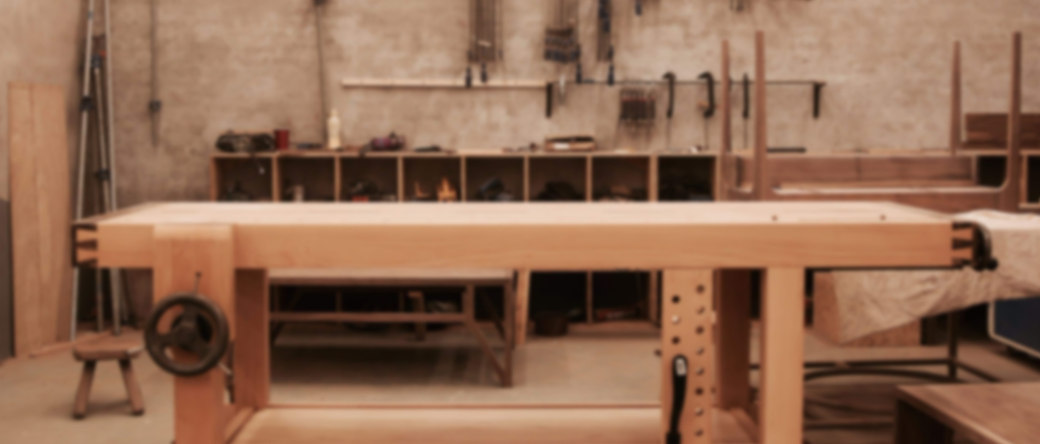 a workbench with tools in the background.