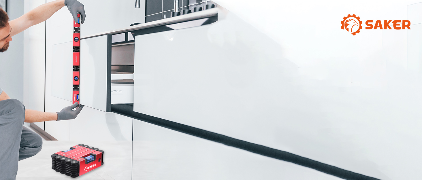 a white kitchen with a black base and a white countertop.